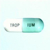 Tropium Pill: a light green and white pill labeled with "TROPIUM" in black