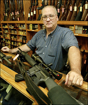 A photo from the Washington Post of a man selling firearms