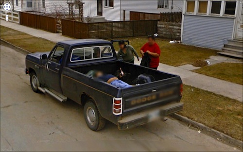Guy in truck bed with beer