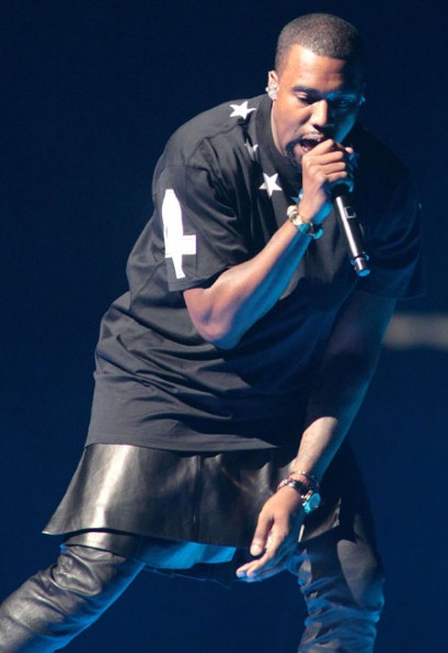 Kanye West dons a leather skirt over pants at a benefit performance for Hurricane Sandy.