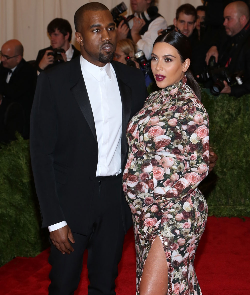 Kanye West and Kim Kardashian pose for a red carpet photo at Monday's Met Gala in NYC.