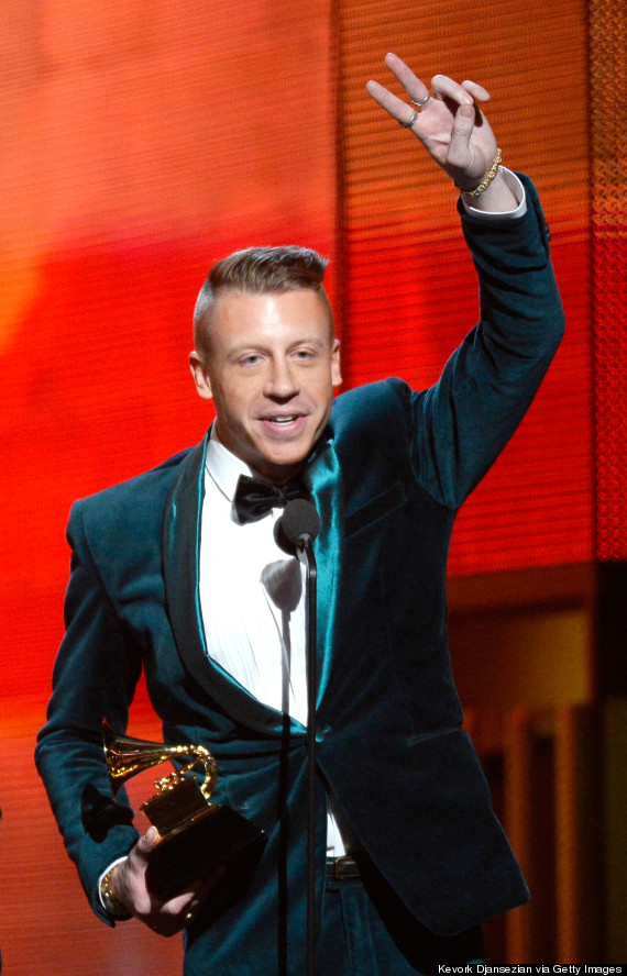 Macklemore accepting his award at the Grammys