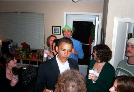 This image depicts Barack Obama in the middle of a holiday party.