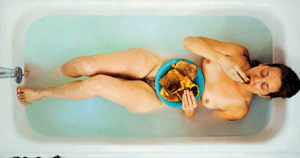 woman eats in a bathtub