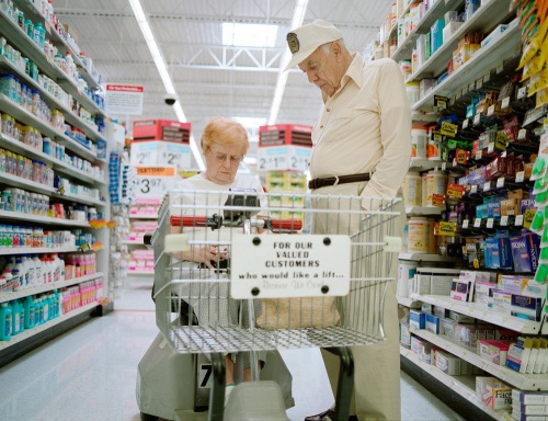 Two elderly people shopping