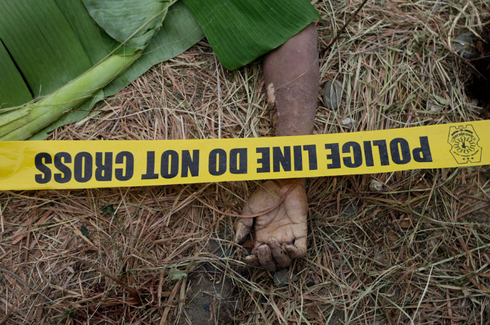 image of hand, police line tape