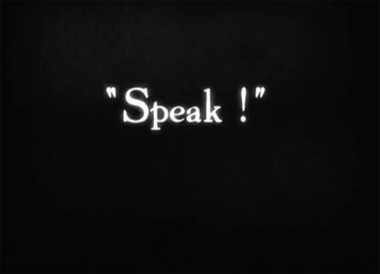 Intertitle from The Artist; white letters against a black background say, "Speak!"