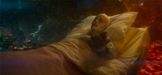 Quill's mother lies in her hospital bed, now suspended against a red-and-blue background that evokes pictures of nebulas.