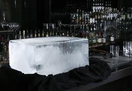 a large block of ice on a fancy bar