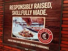 a chipotle sign that says responsibly raised 