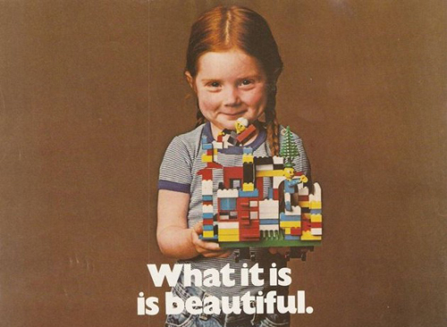 A girl holds up a multicolored LEGO set. Text reads: "what it is is beautiful."