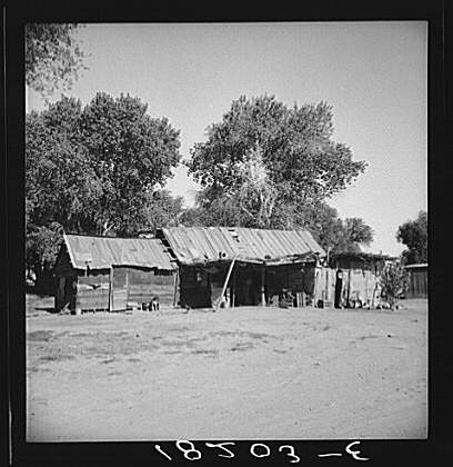 Mexican laborer's house and 1500 acre cantaloupe ranch adjacent to Mexican border. Imperial Valley, California