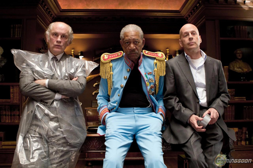 John Malkovich, Morgan Freeman, and Bruce Willis look at the camera in the 2010 film, Red.