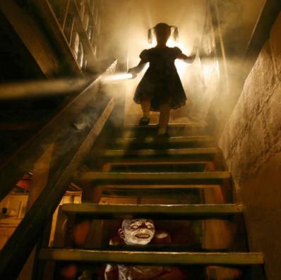 Girl descends basement stairs to waiting monster