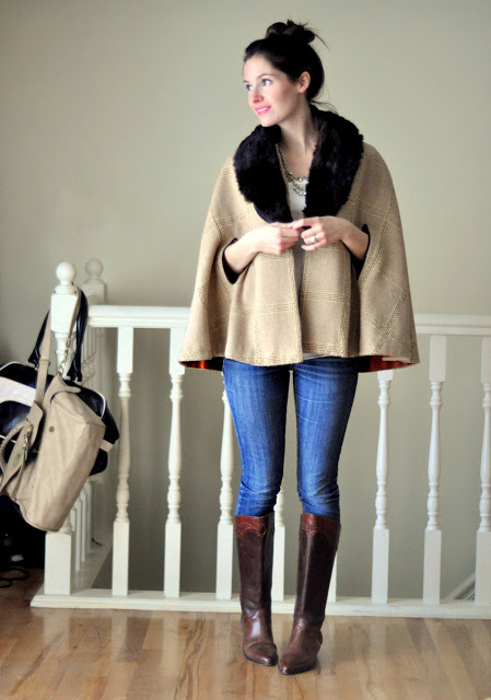 Cotton and Curls blogger models a fur coat and skinny jeans with tall boots.