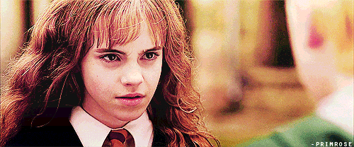Hermione Granger and Lucius Malfoy of Harry Potter fame eye each other in this gif.