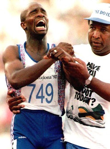 Rodman crosses the finish line dead last with the help of his father