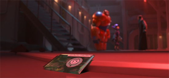 Baymax's original control chip lies on the ground, while Baymax goes into a violent mode in the background.